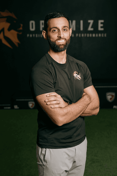 Profile of Dr Zaki Afzal, facking camera, arms crossed